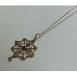 SUFFRAGETTE: An attractive gold pendant with loop