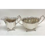 A good quality silver plated cream jug and sugar b