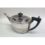 A good quality Victorian silver teapot with hinged