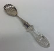 An Edwardian silver salad server with glass handle
