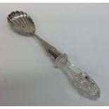 An Edwardian silver salad server with glass handle