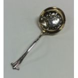 A silver sifter spoon with gilt bowl. London. Appr