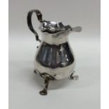 A good Georgian silver helmet shaped cream jug on
