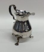 A good Georgian silver helmet shaped cream jug on