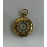 An 18 carat half Hunter fob watch with white ename