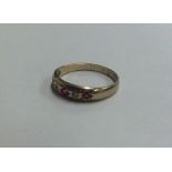 A ruby and diamond gypsy set ring. Approx. 1.6 gra