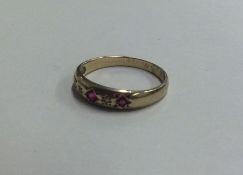 A ruby and diamond gypsy set ring. Approx. 1.6 gra