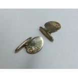 A pair of 9 carat cufflinks. Approx. 4 grams. Est.