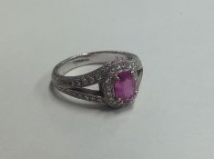 A fine quality pink sapphire and diamond cluster r