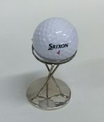 An unusual silver trophy cup in the form of golf c