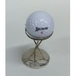 An unusual silver trophy cup in the form of golf c