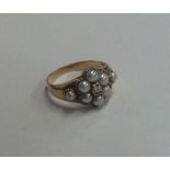 An Antique pearl and diamond mourning ring. Approx