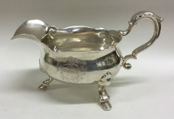 A large heavy Georgian silver sauce boat with shap