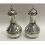 A pair of good quality Victorian silver peppers wi