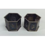 A pair of unusual Niello napkin rings decorated wi