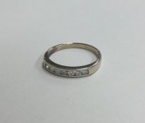 An 18 carat gold and diamond half eternity ring. A