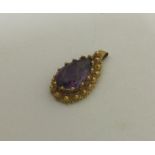 A Victorian high carat gold amethyst pendant. Appr