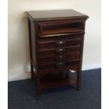 A mahogany music cabinet. Est. £40 - £60.