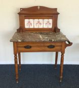 A satinwood marble top wash stand on turned suppor