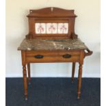 A satinwood marble top wash stand on turned suppor