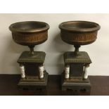 A pair of attractive porcelain mounted urns decora