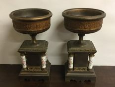 A pair of attractive porcelain mounted urns decora