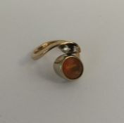 A stylish 9 carat fire opal and diamond ring. Appr