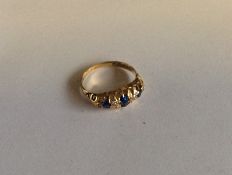 A sapphire and diamond seven stone ring in 18 cara