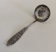 An attractive pierced silver sifter spoon with pie