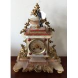A stylish alabaster and inlaid French mantle clock