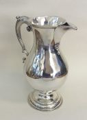 A fine quality George III beer jug of baluster for
