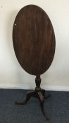 A small Georgian mahogany oval tilt top table. Est