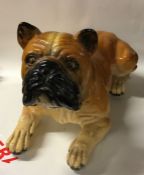 A large figure of a seated Bulldog. Est. £20 - £30