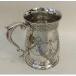 A George II silver baluster shaped mug decorated w