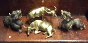 A pair of heavy brass figures of oxen etc. Est. £2