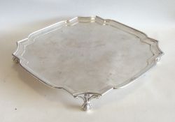 An Edwardian silver square waiter with cut corners