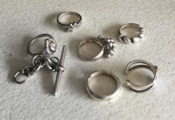 A small bundle of silver gem set and other rings.