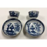 A pair of Chinese blue and white tea bowls and sau