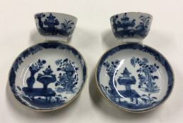 A pair of Chinese blue and white tea bowls and sau