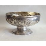 A Georgian silver and embossed bowl decorated with