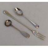 A silver salt spoon together with a pickle fork. A