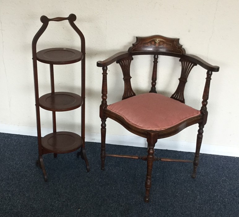 An inlaid corner chiar together with a cake stand.