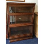 An oak three stack Globe Wernicke bookcase. Est. £