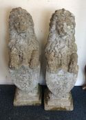 A pair of concrete figures of rampant lions. Est.