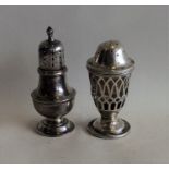 An Edwardian silver pepper together with one other