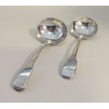 A pair of silver fiddle pattern sauce ladles. Punc