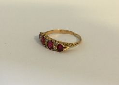 An attractive ruby and diamond ten stone ring in c