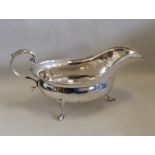 A heavy Edwardian silver sauce boat with bead edge