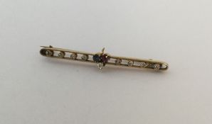 A high carat gold brooch inset with diamond clover