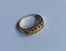 A diamond and yellow stone three row ring. Approx.